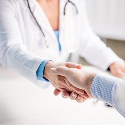 Image of doctor shaking patient's hand